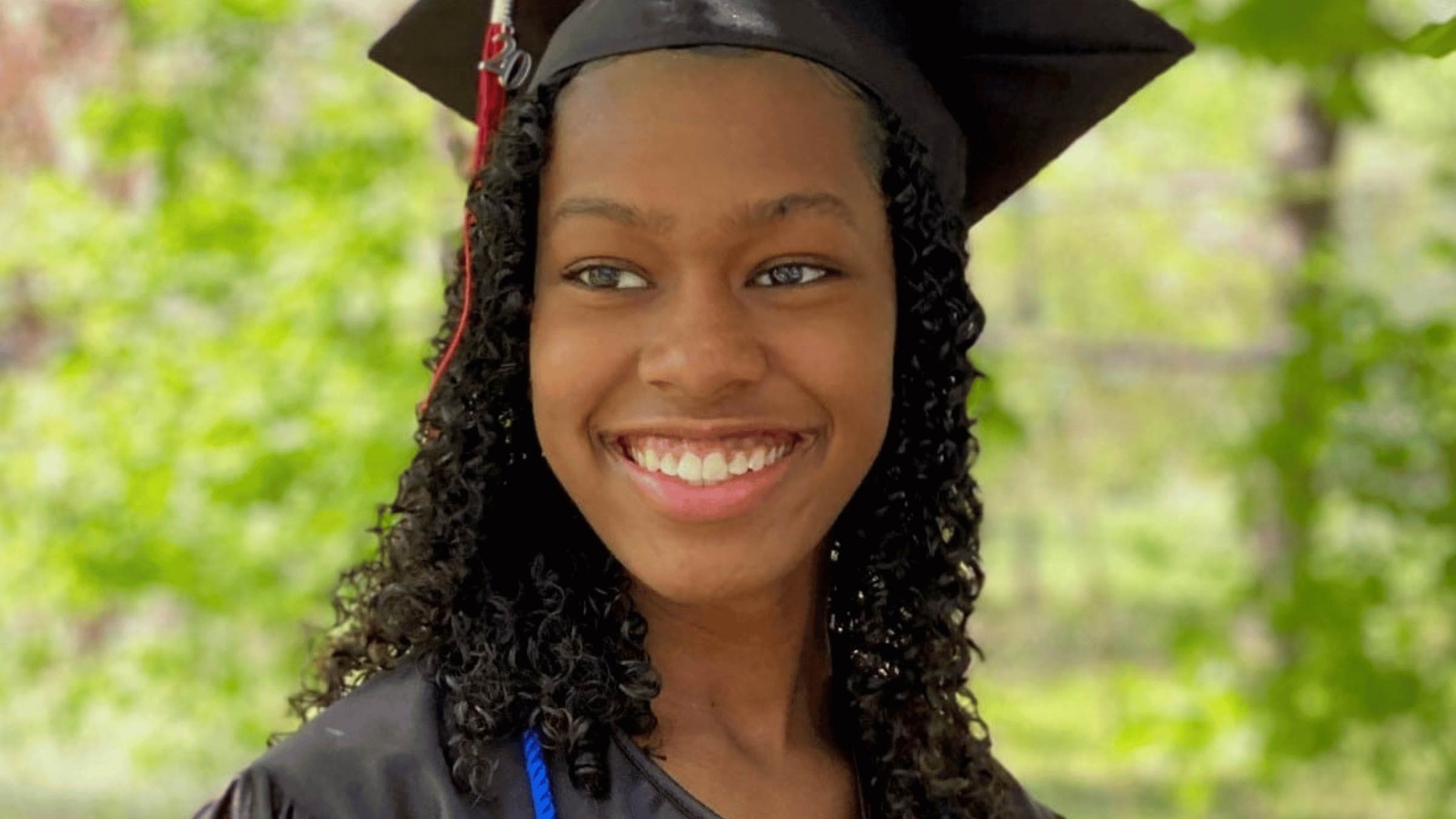 Young woman wearing graduation cap