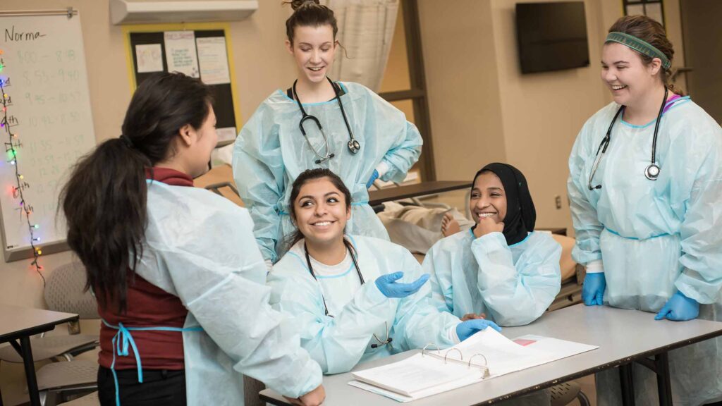 A group of medical professionals together talking.