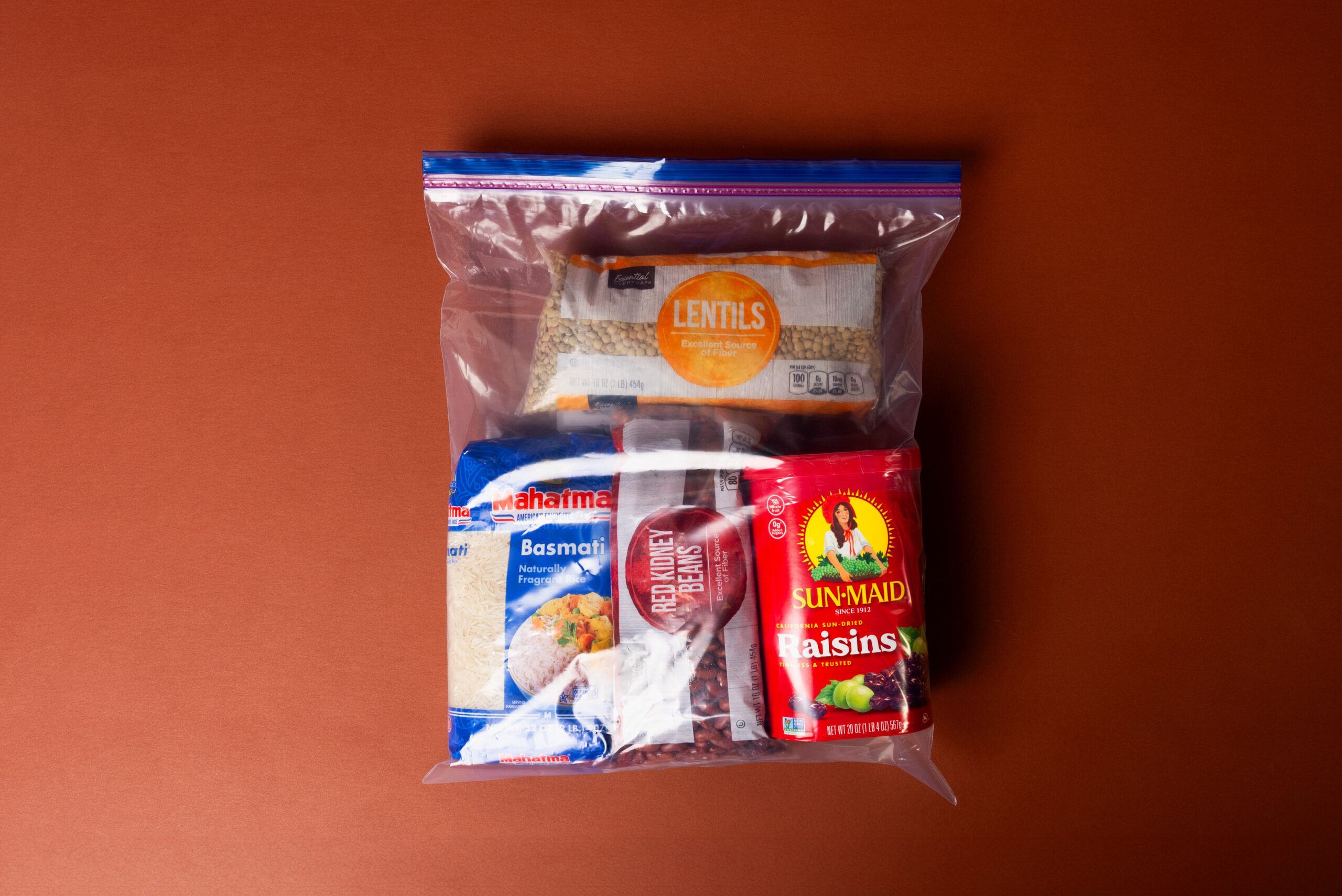 A Ziploc bag is filled with Afghan staple food items