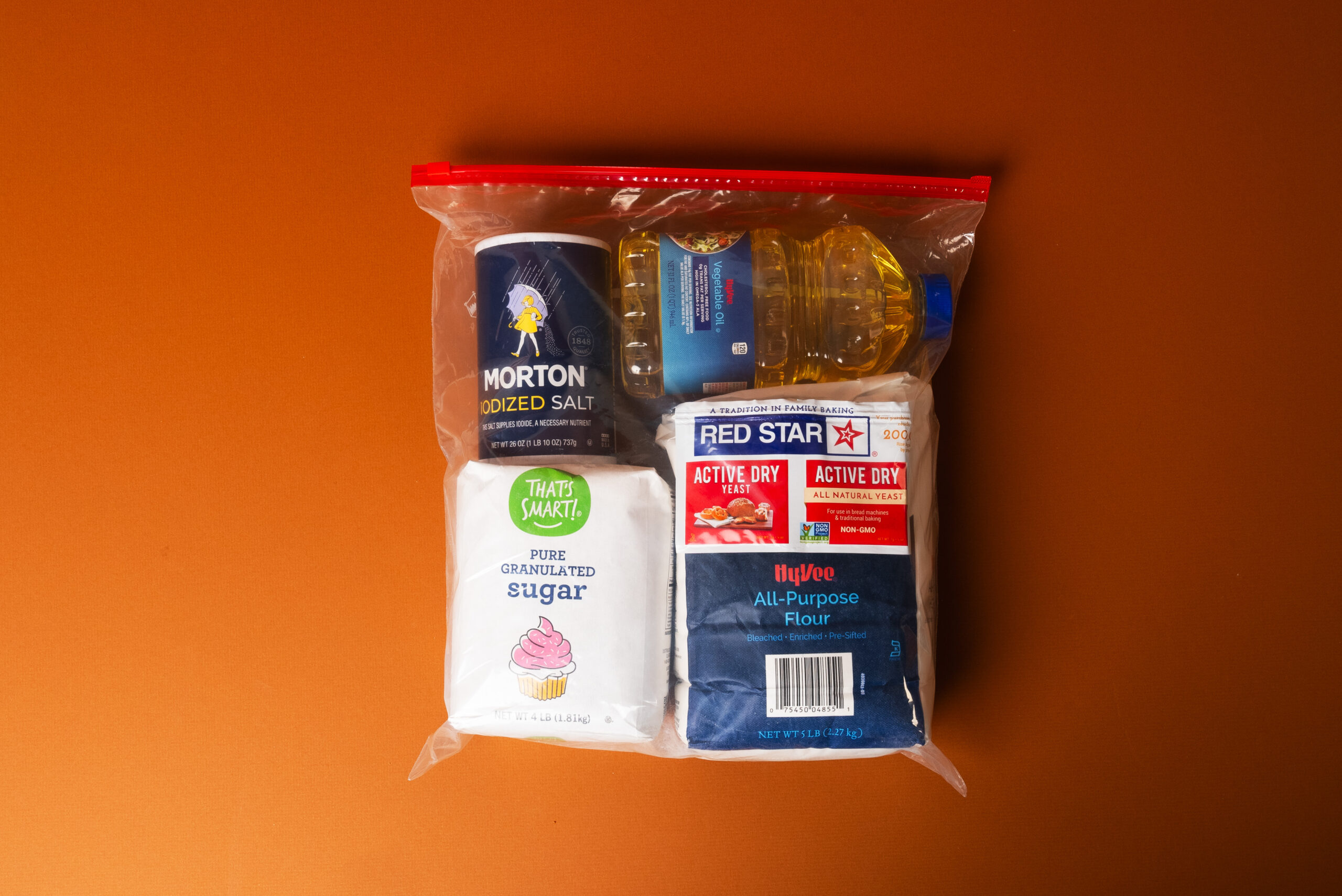 A Ziploc bag is filled with staple baking items