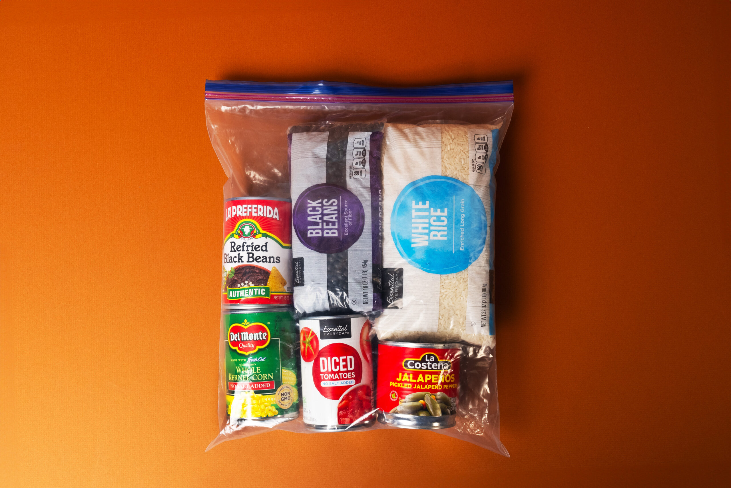 A Ziploc bag is filled with Latinx staples including white rice and black beans
