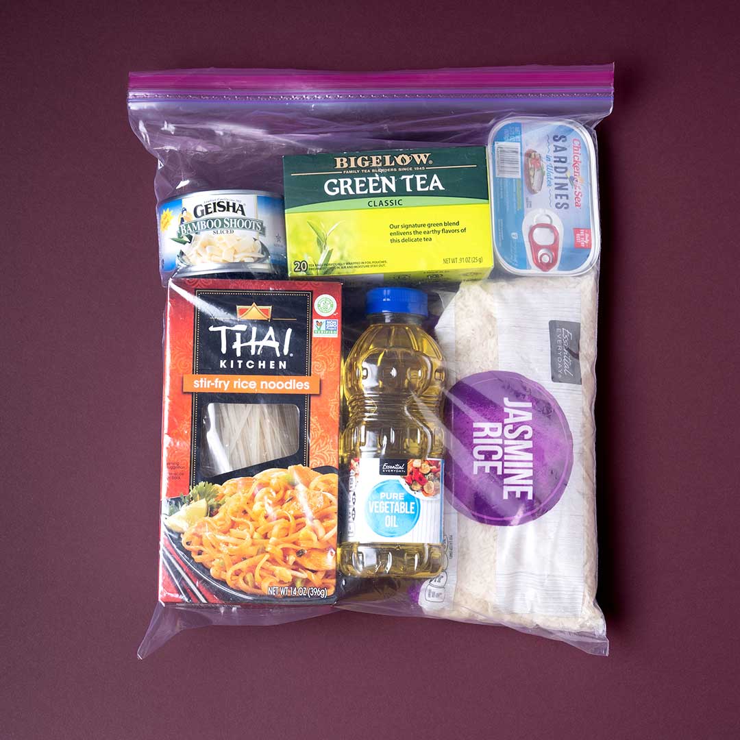 A Ziploc bag is filled with ingredients familiar to the Karen community including rice noodles, vegetable oil, and bamboo shoots.