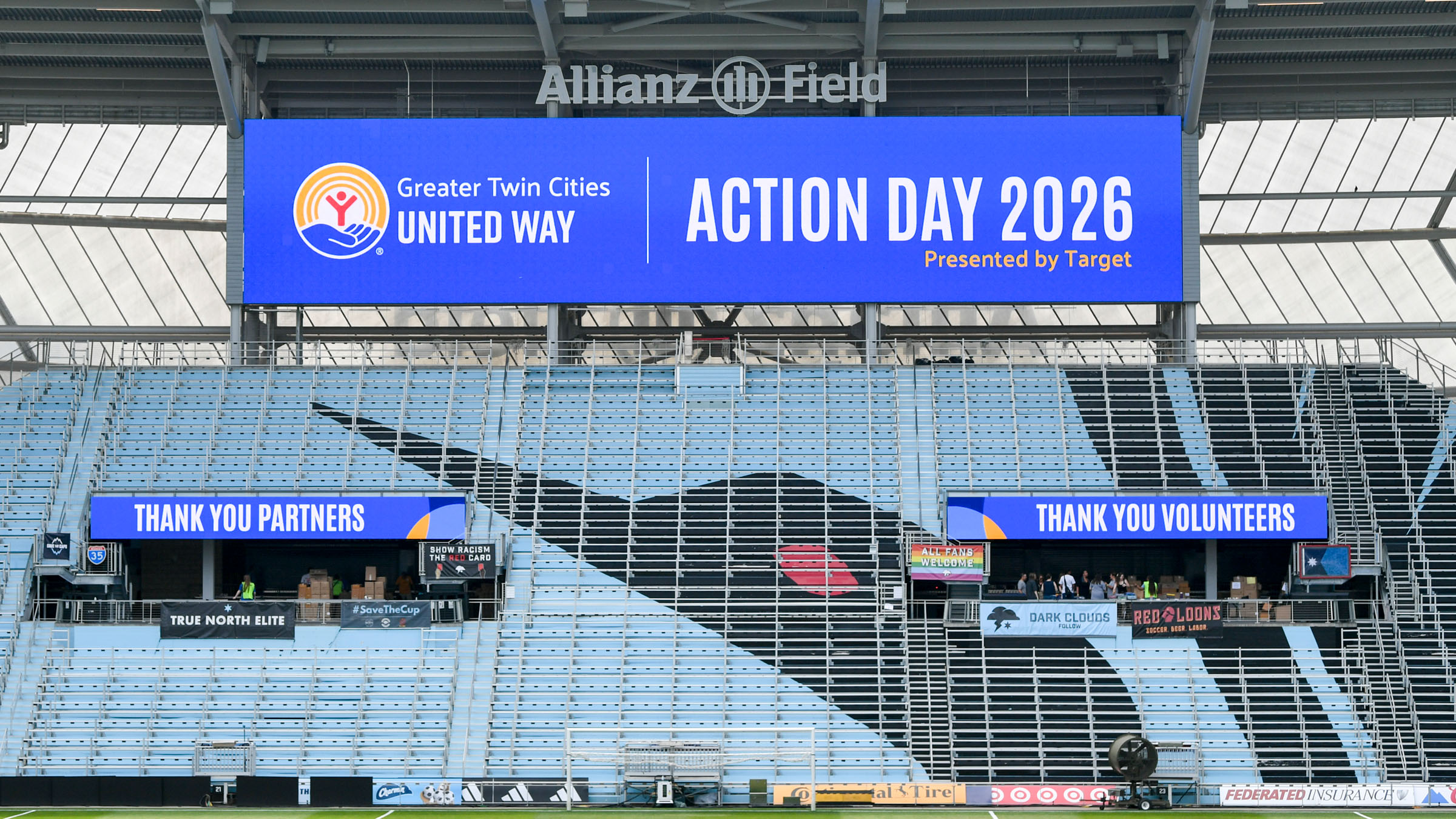 Allianz Field stadium with digital signs that say "Thank you partners," "Greater Twin Cities United Way Action Day 2026," and "Thank you volunteers"